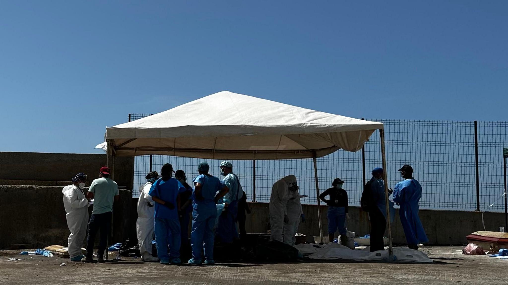 World image related to Venezuela quake: families forced to identify victims at makeshift morgue